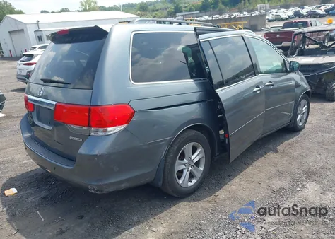 2010 Honda Odyssey Touring z USA, uszkodzony, nr VIN 5FNRL3H96AB053727